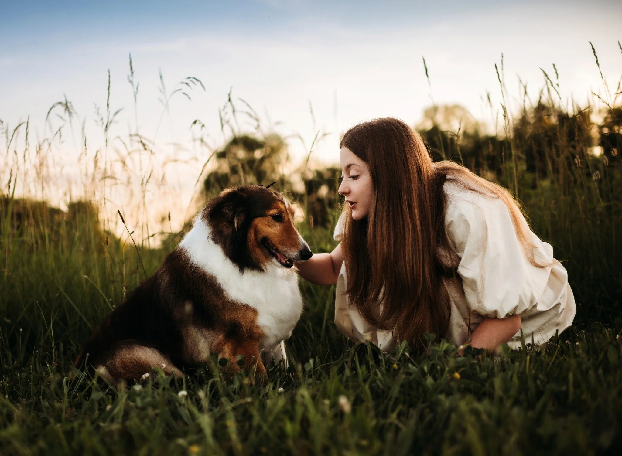 girl and her dog at sunset