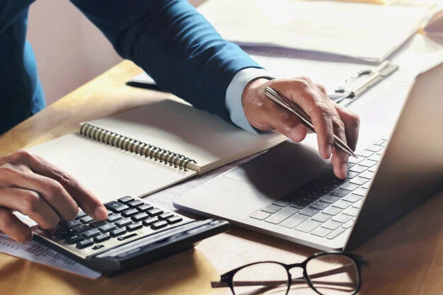 businessman-working-desk-with-using-calculator-computer-office-concept-accounting-finance_34152-2247.jpg