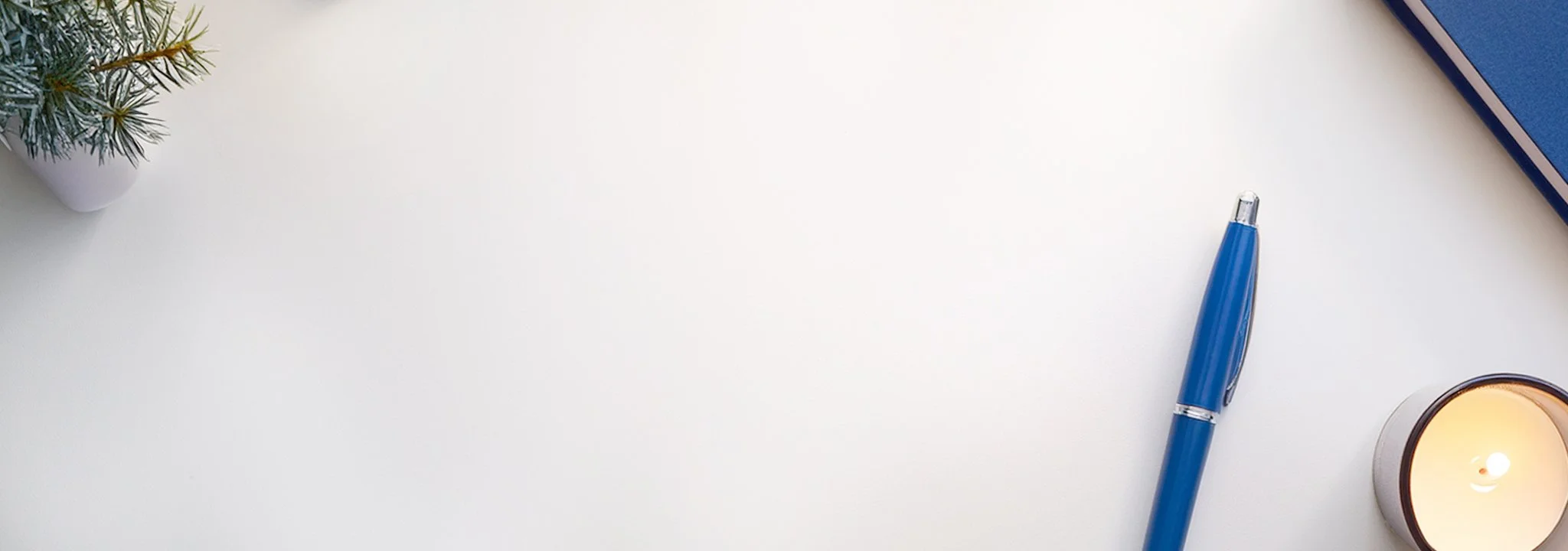 Clean desktop with a blue pen beside text about estate planning, wills, and trust guidance.