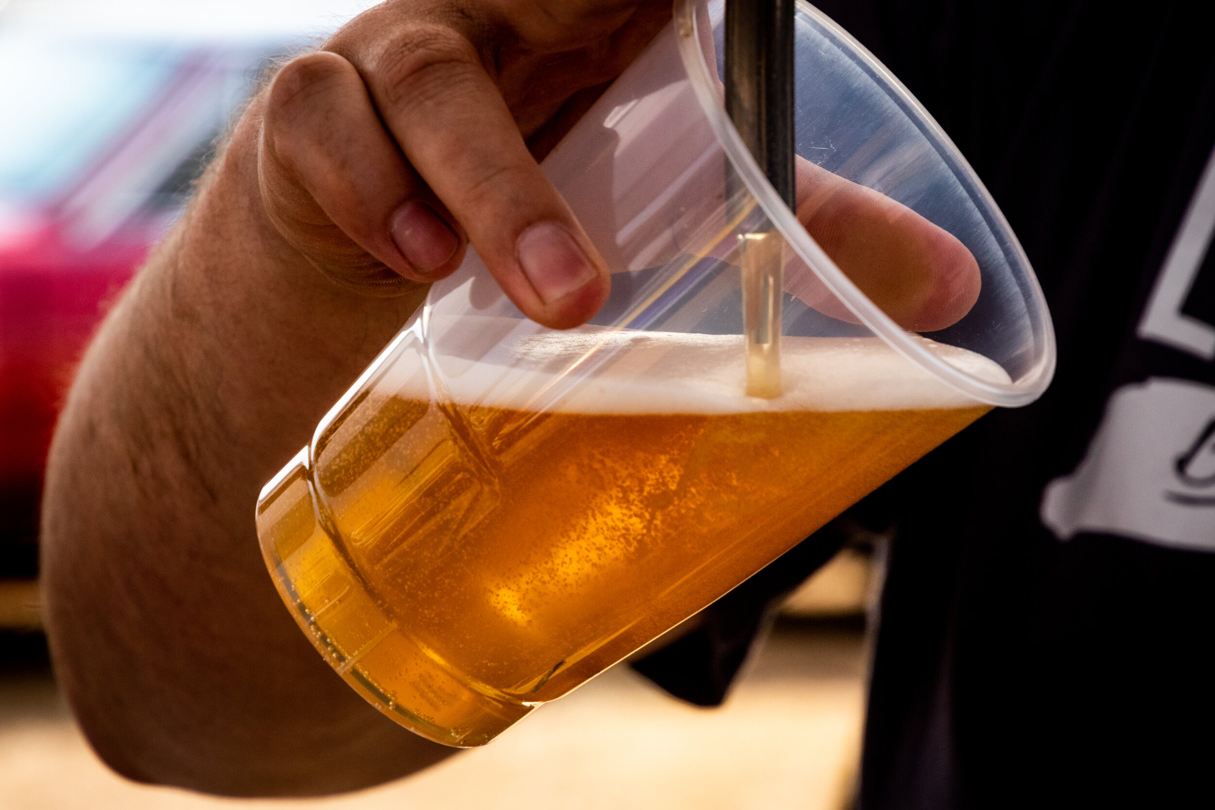 Canva - Person Pouring Beer on Clear Cup.jpg