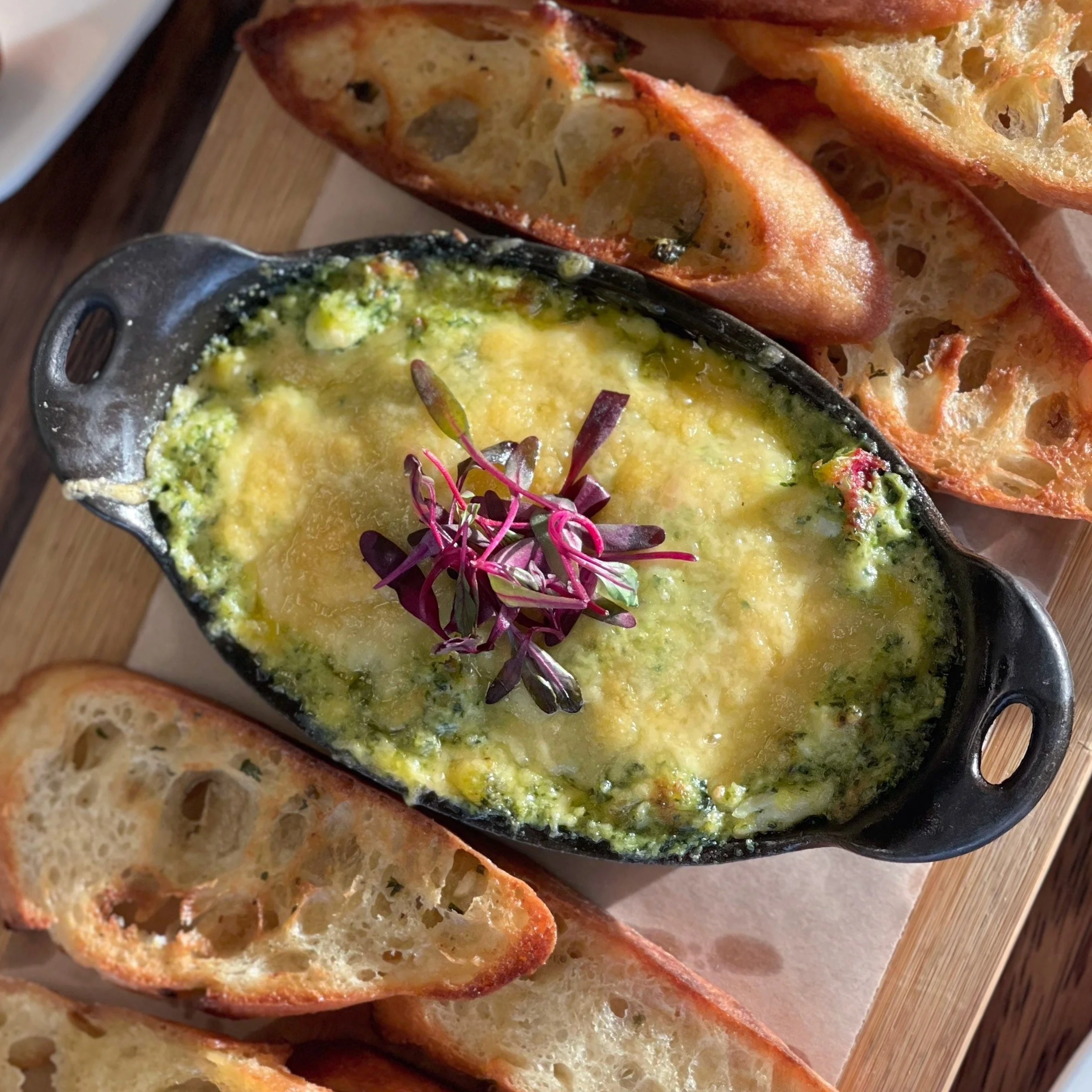 Spinach Artichoke Dip in personal cast-iron skillet, with crostini