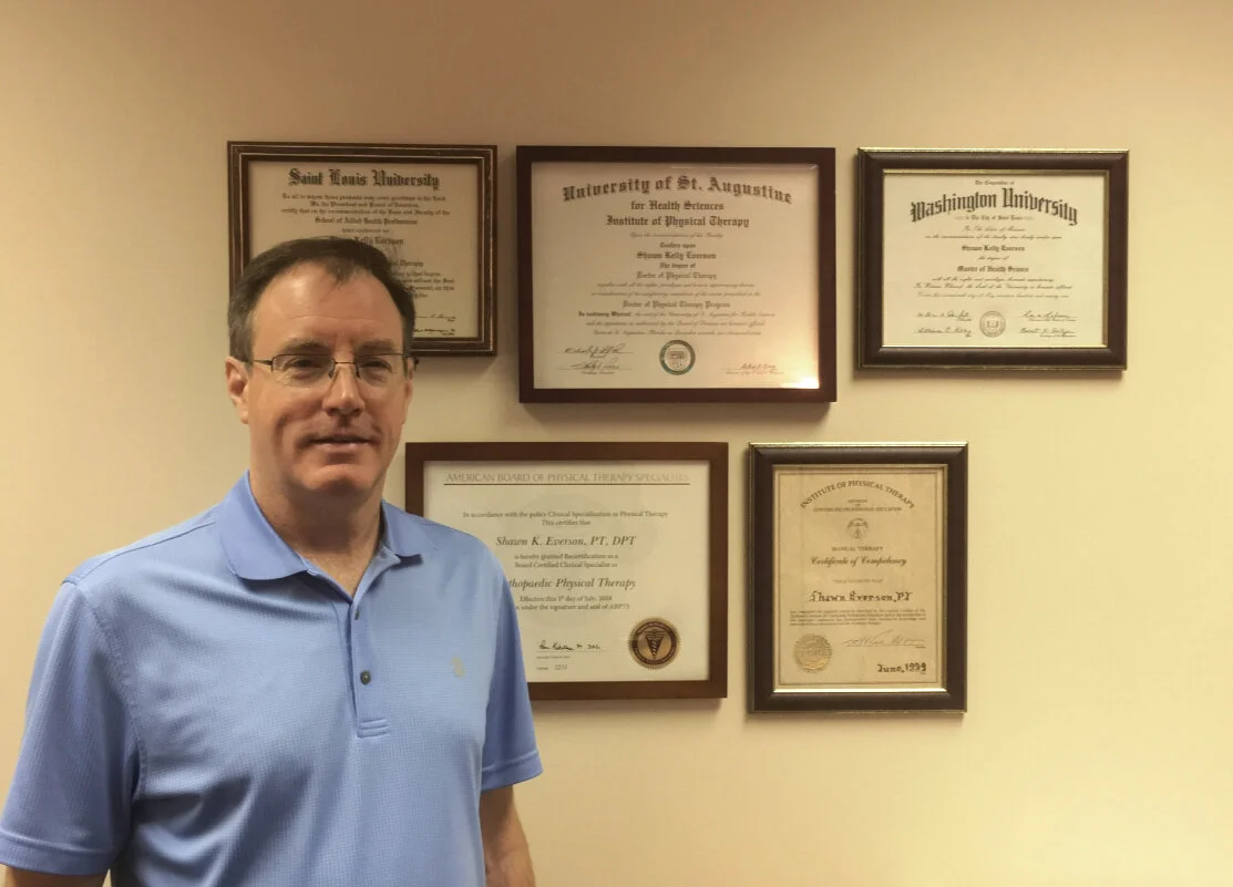 Shawn with degrees_2.jpg