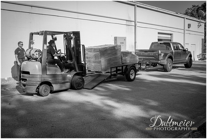  Pallets of PPE are loaded onto Dr. Parr’s flatbed trailer by a Stuart Harbor Freight employee. 