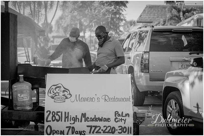  Jimmy Smith, owner of Jimmy Smith Barbeque and president of the  Martin County NAACP  volunteers with Greg Scott to cook hamburgers at the grill. Scott owns  Great Scotts Catering . 