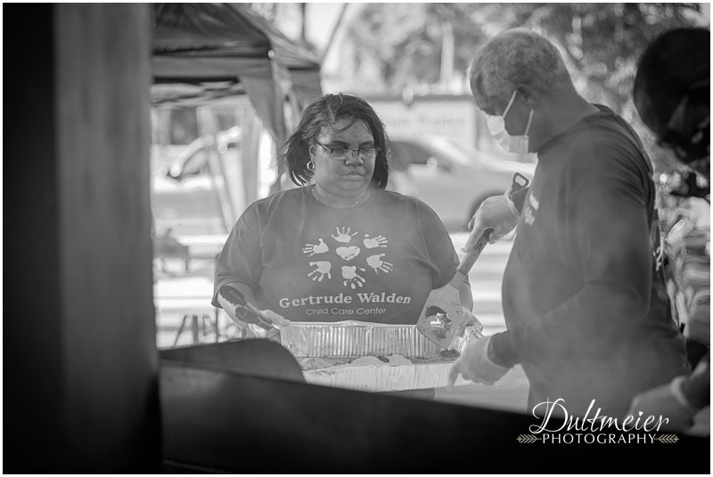  Timeka Williams, Gertrude Walden Childcare Center employee, gets more burgers from Jimmy Smith. 