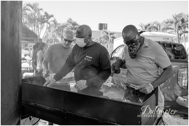  Left to right, Tony Huerta, Jimmy Smith and Greg Scott, making burgers in the hot Florida weather. 