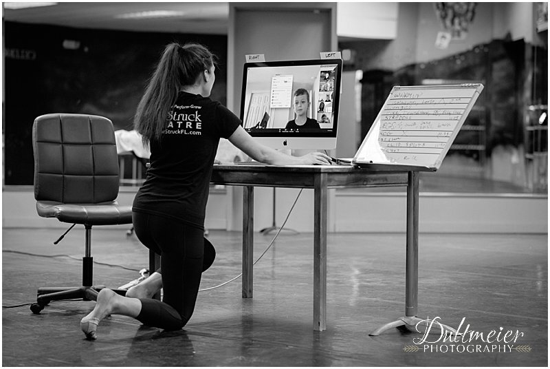  Anastasia talks with student Theo Carrigan as they begin a stretching class. 