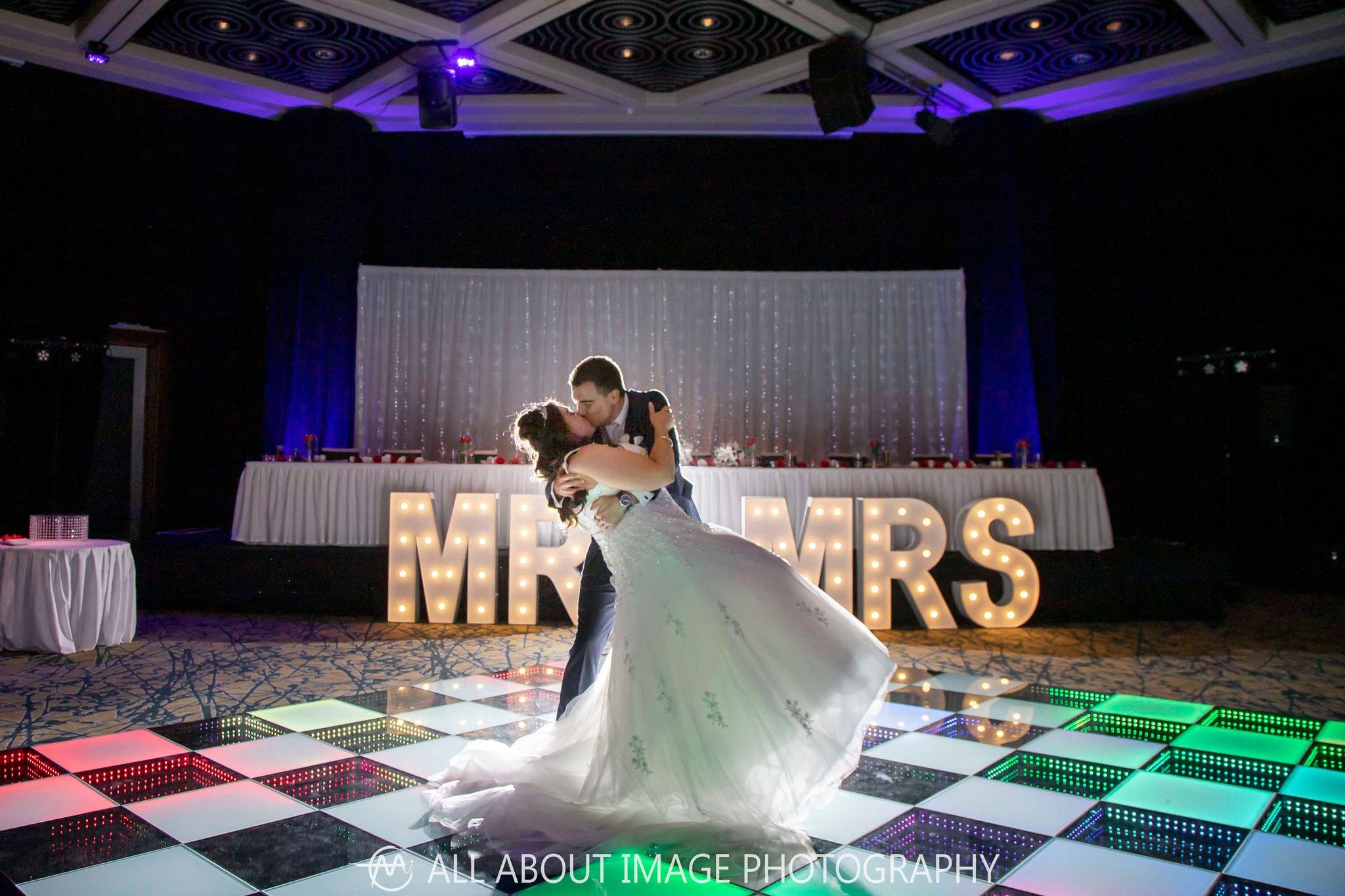 Newly Weds kissing on a LED Dance Floor at Hyatt Regency Perth