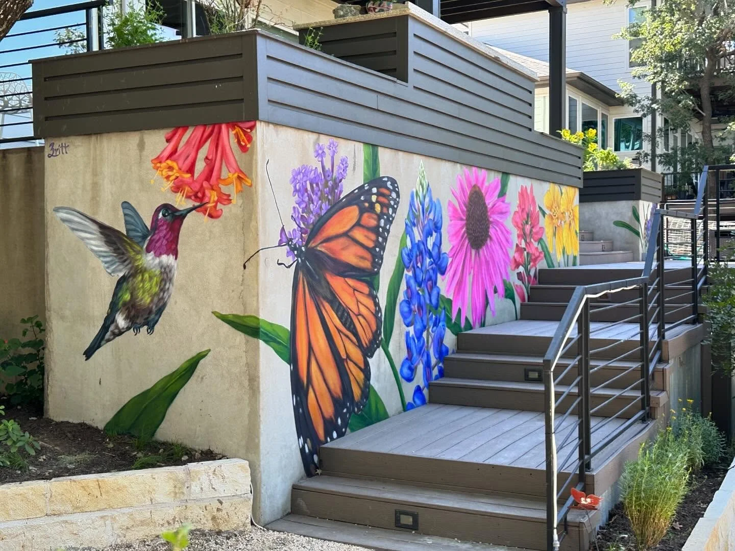 Final photos of recent backyard flower mural.  I love the raw concrete showing through.  Used a spray paint base and acrylic for details.  Getting better at flowing between the two and definitely have gotten more efficient with brush as I&rsquo;ve be