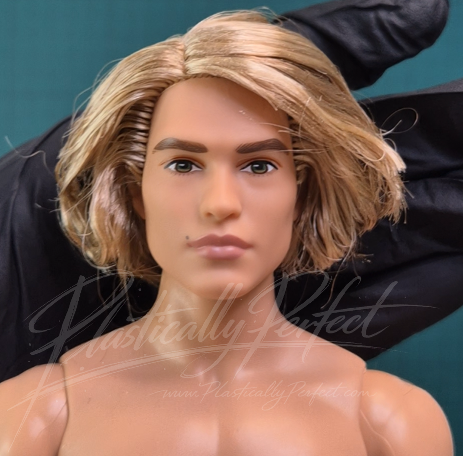Masters of the Universe He-Man Ken Doll, the image is focused on the face (front facing), which features a new face mold based on Nicholas Galitzine.