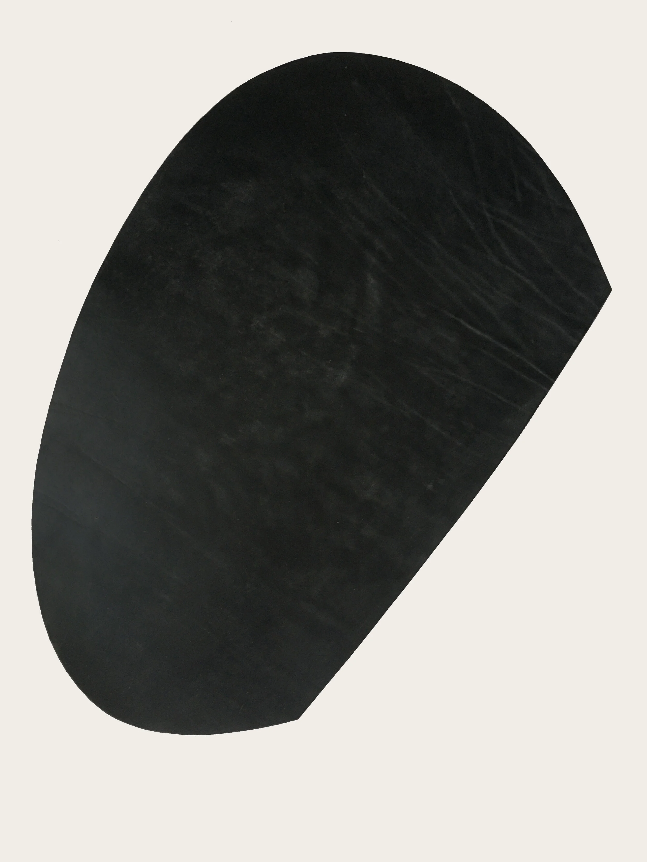 ‘Corner’, 2020. Black, Oak bark tanned leather, 55 cm L x 90 cm W x  1 cm D