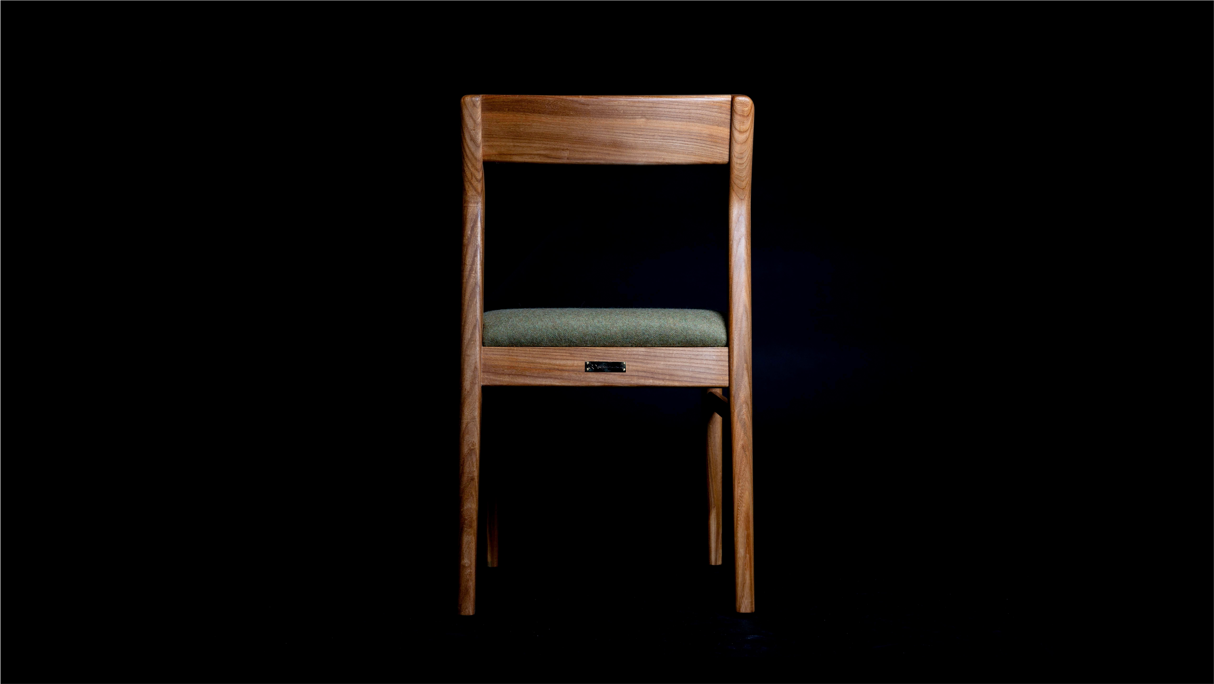 Back view of Clava Dining Chair in elm.