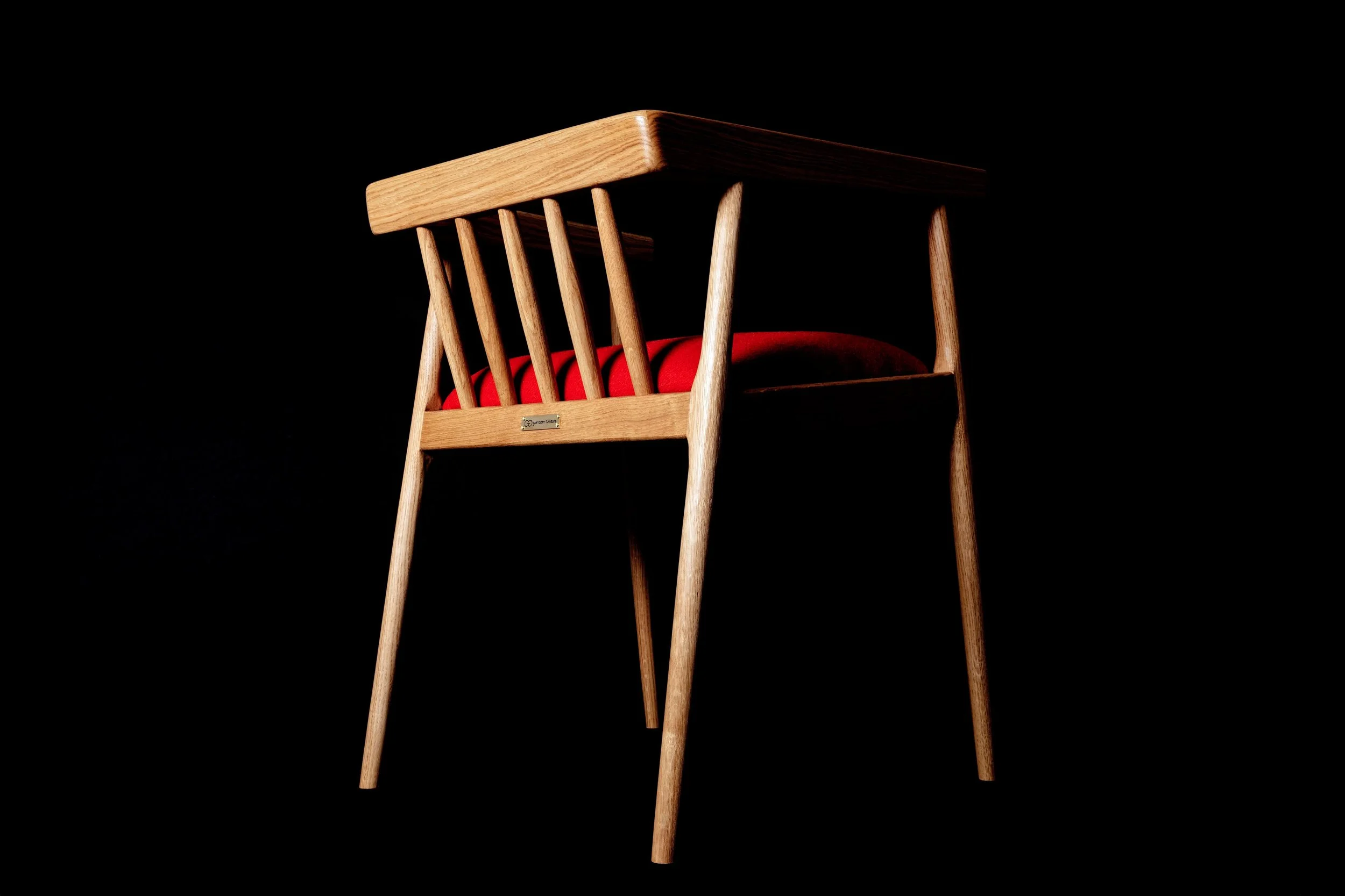 Glencairn Furniture's Winzer Dining Chair in oak with orange upholstery