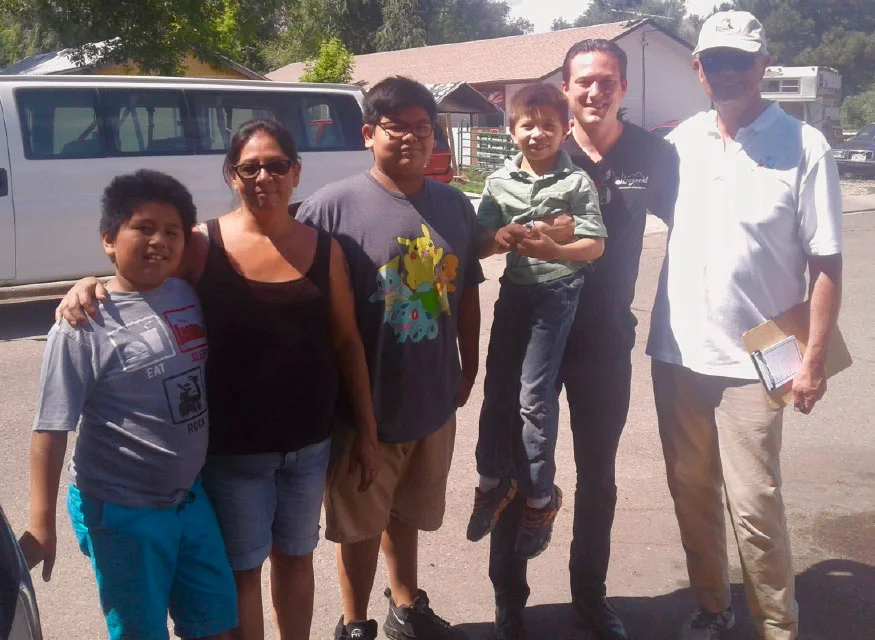 LSO Music Director Elliot Moore with Richard’s family. Longmont Chief of Police Mike Butler is far right. (Photo Credit: Dan Benavidez)