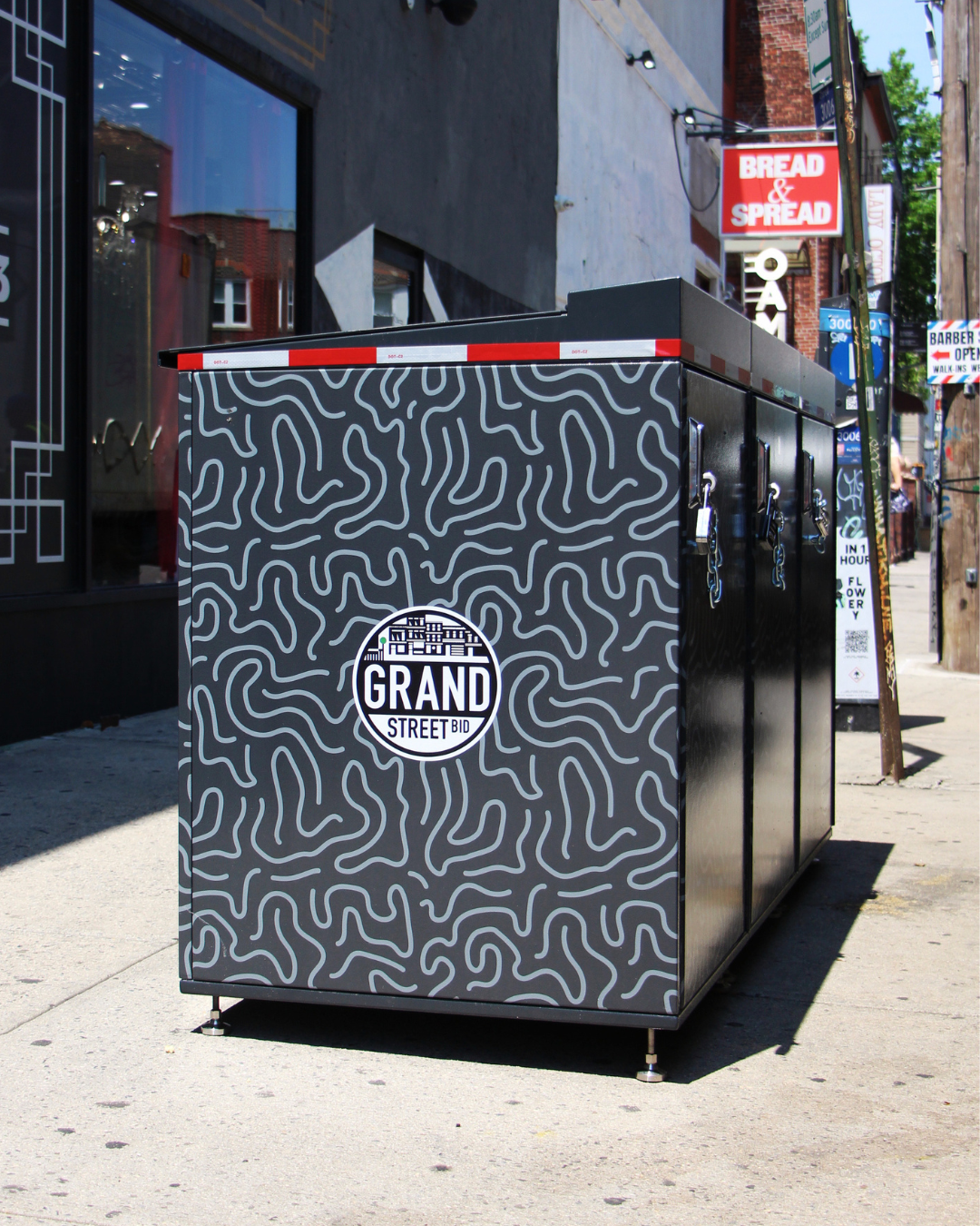 Grand Street BID Installs New Trash Containers