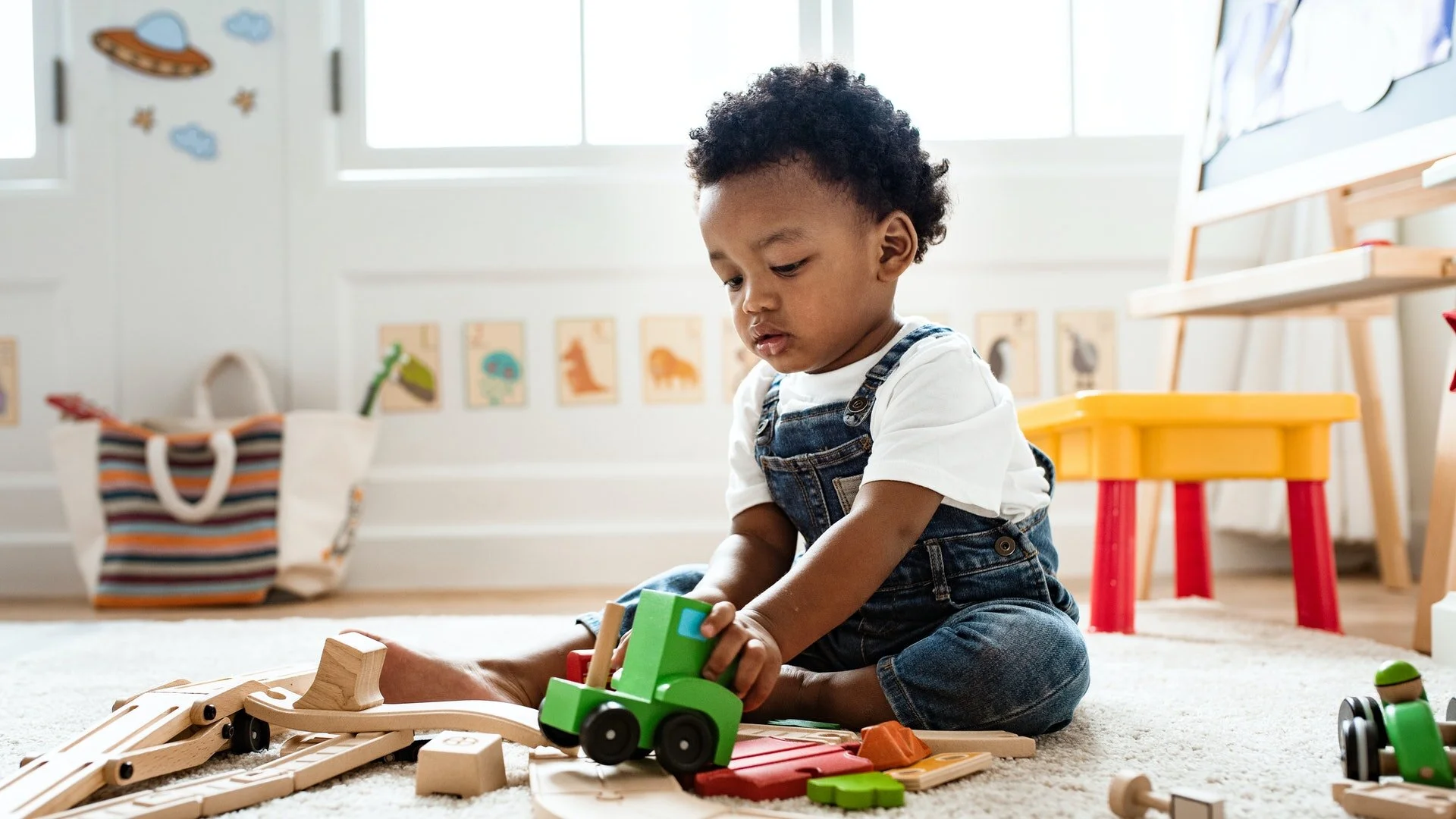 When Do Babies Really Start Playing With Toys? An Expert Explains