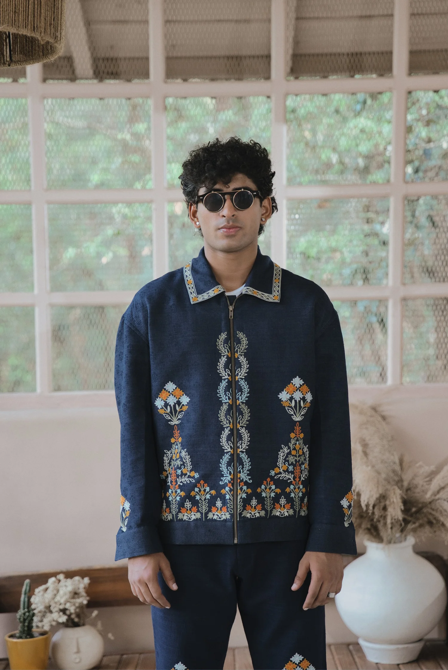 Navy silk zip down collar jacket featuring chain stitch embroidery 