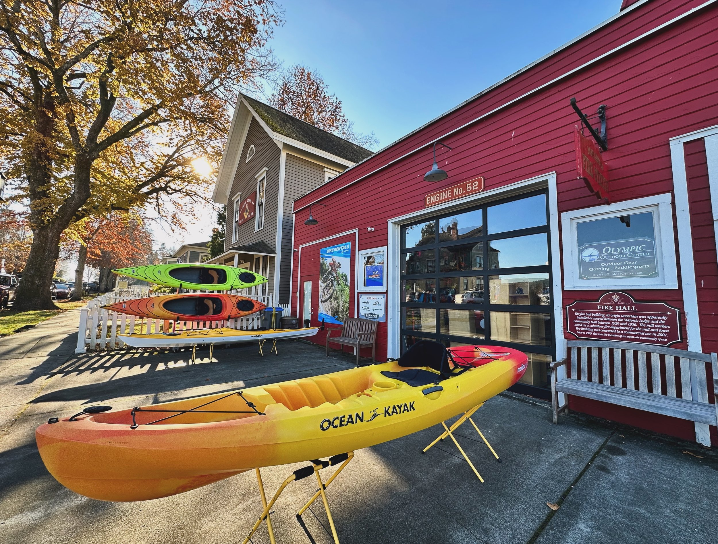 Autumn in Port Gamble. This super cute and oh-so walkable Victorian era mill town is waiting for you to explore its white picket fence lined streets as the leaves turn orange, yellow and red! Learn more at kitsap.love/port-gamble #lovekitsap