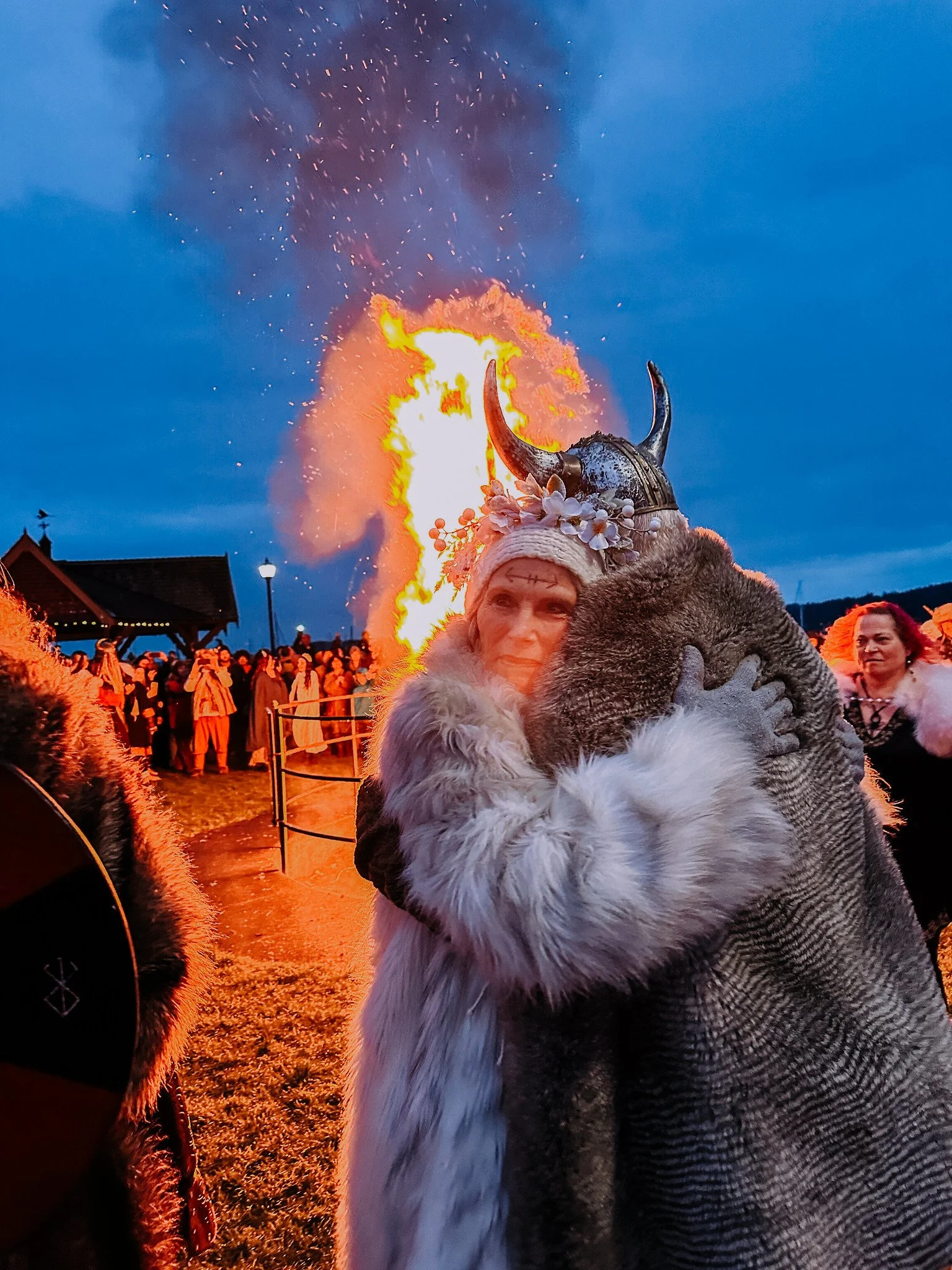 Viking love birds embrace affectionately during the Viking bonfire on Valentine's Day in Poulsbo, WA