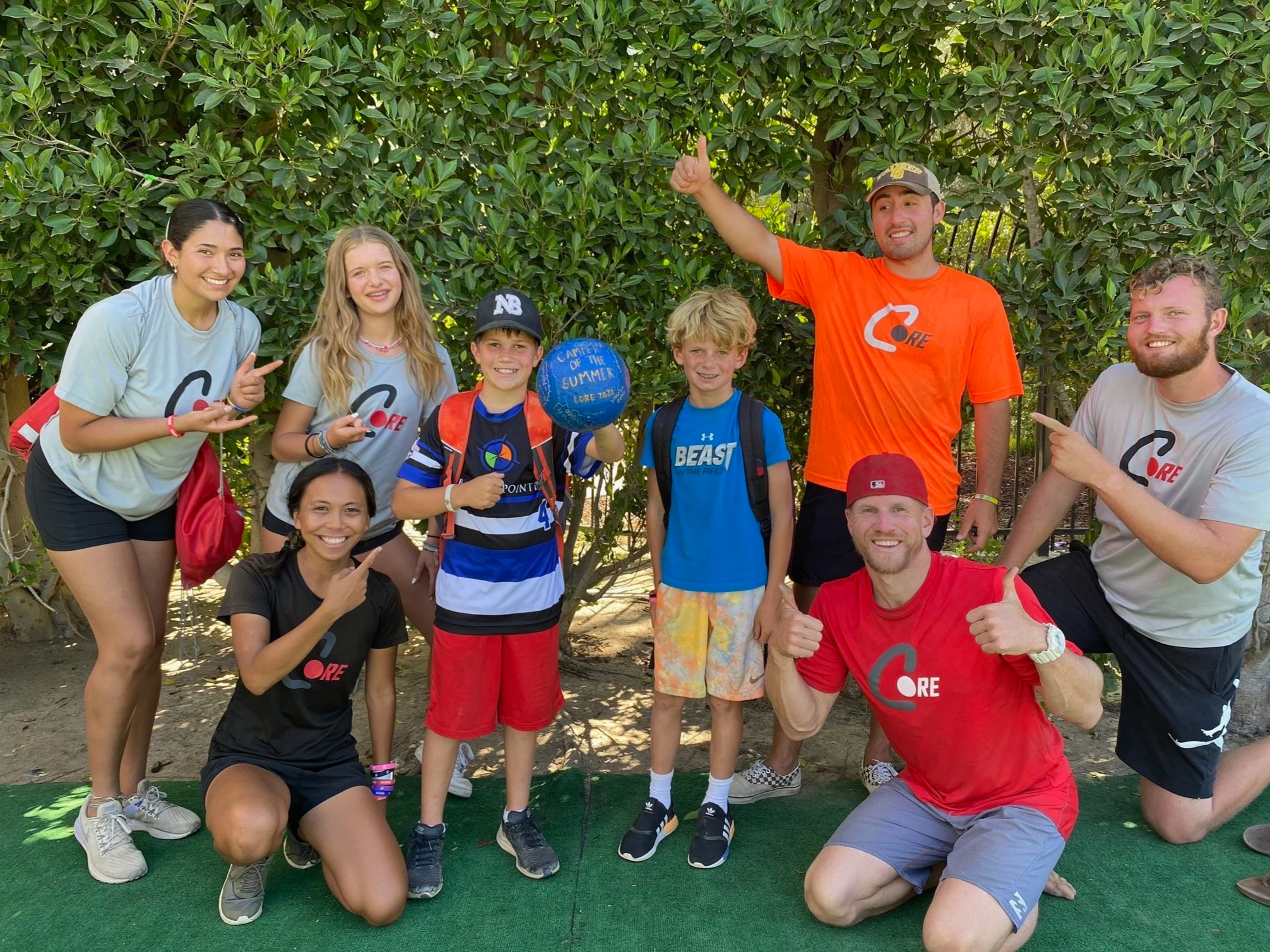 CORE coaches and campers celebrating together during summer camp.