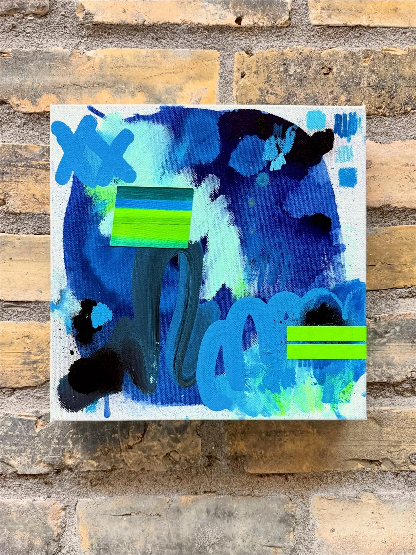 Signals In The Night
10x10&rdquo; // Mixed media on canvas &mdash; acrylic, spray paint, oil stick, graphite, tape
2025 // Briana Auel

This abstract mixed media painting is a study of blue emotional fields, neon interruptions, and layered marks that