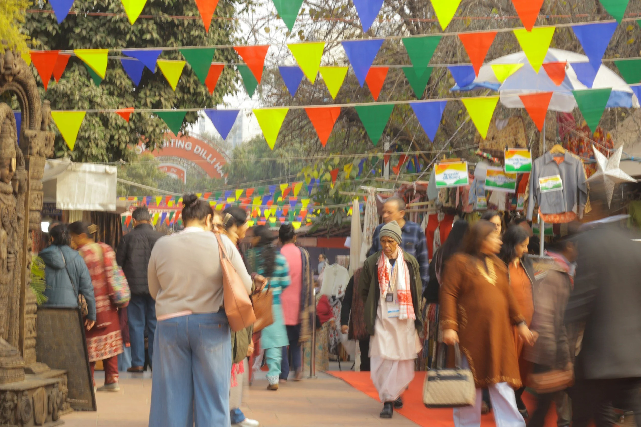 Day 25 - Busy: A crowded market scene with bunting and lots of people mingling