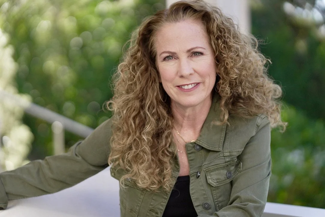 Parenting coach Jeanine Mouchawar smiling outdoors, helping parents rebuild trust with teenagers after lying or betrayal