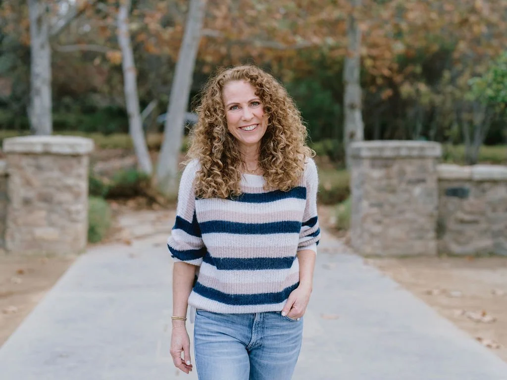 Parenting coach Jeanine Mouchawar outdoors, supporting parents of teens who argue about everything and struggle with daily conflict