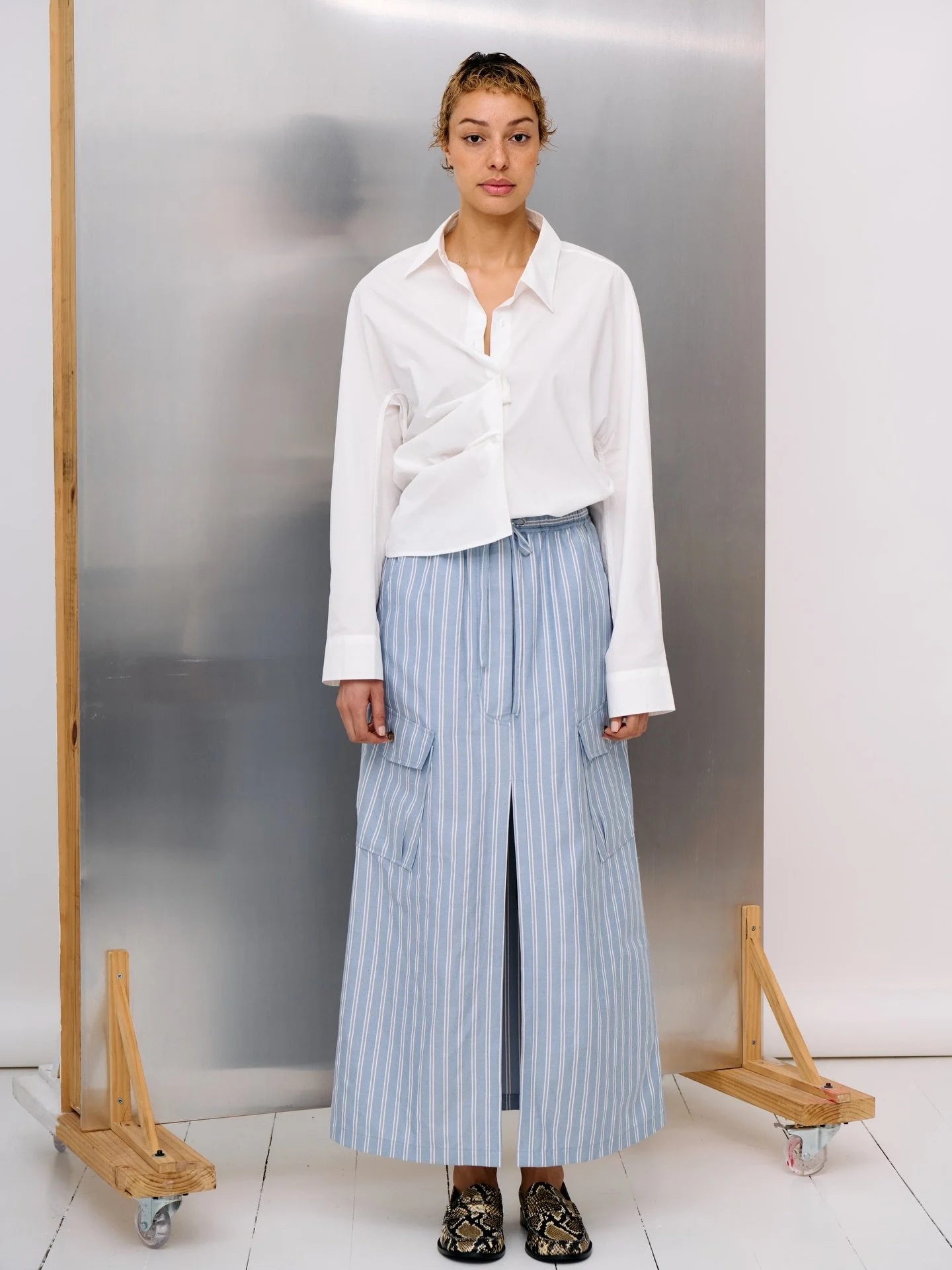Crisp white cotton in the Rhys shirt, paired with the Nevaeh skirt. On repeat.