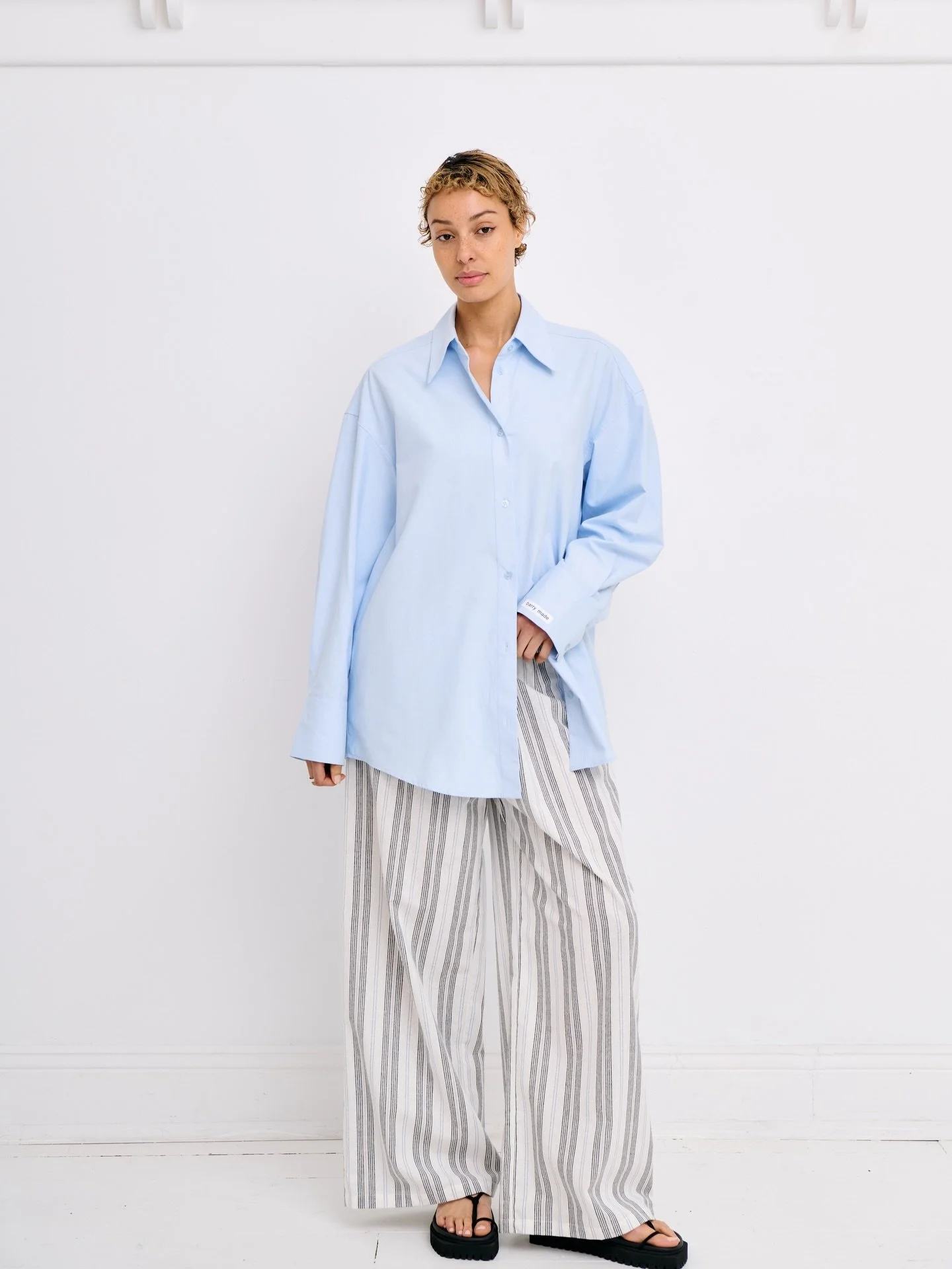 Joaquin oversized shirt in blue cotton paired with the stripes Sunday pants. Now in store.