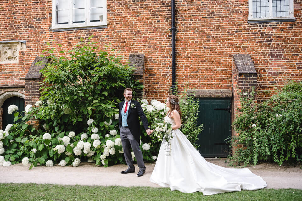 Bride and Groom walking Fulham Palace Wedding