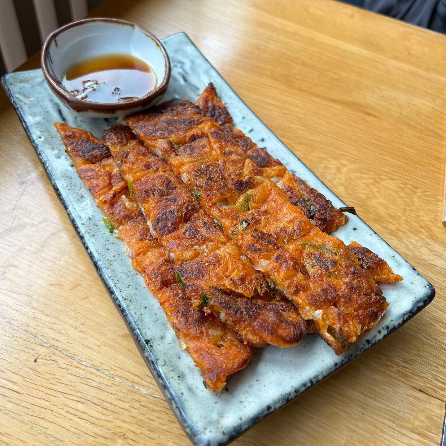 Delicious pan fried kimchi pancake served with soy sauce 😍

Kimchi Jeon - &pound;8.50 
.
.
.
.
.
.
.
#instagram #instafood #food #koreanbbq #kbbq #london #ukig #superstarbbq #halalfoodlondon #halalfood #kimchi #kimchijeon #kimchipancake #pancake