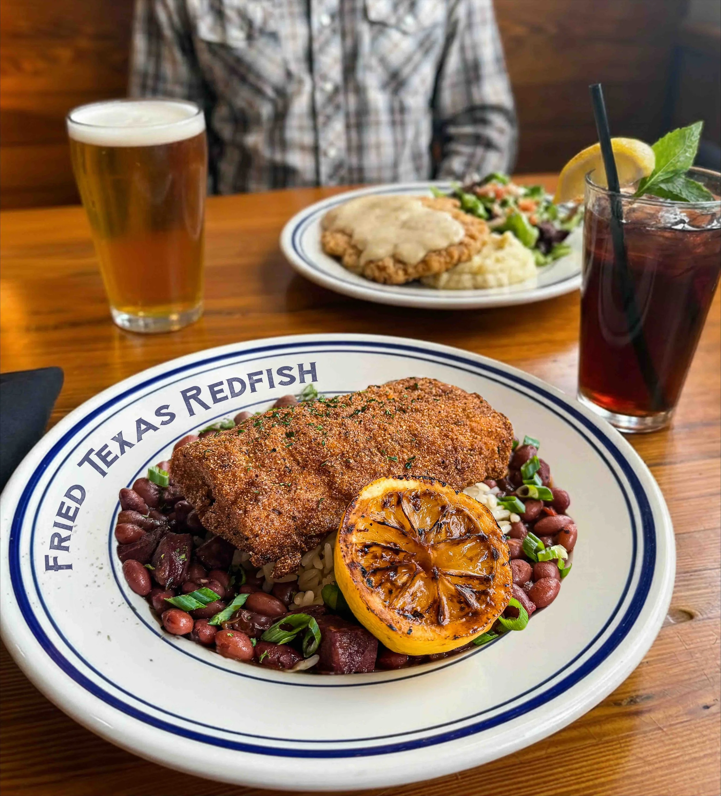 fried Texas redfish with red beans & rice, with a charred lemon
