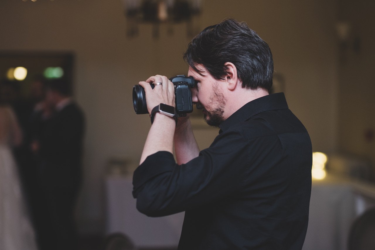 wedding videographer in Kent filming reception drinks in a calm, unobtrusive way