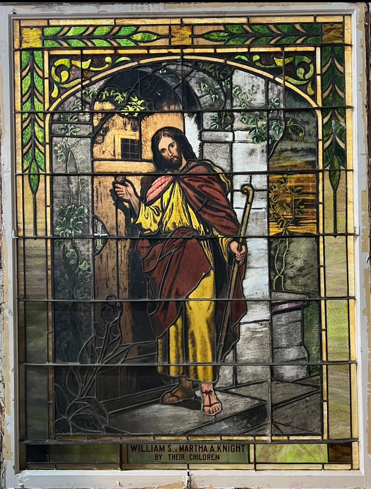 Huge stained glass window w/ religious figure