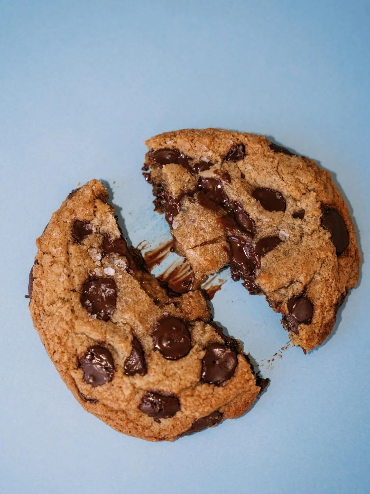 Chocolate chip cookies, just the way they should be. Lightly salted, full of chocolate, and made fresh in house daily. 🍪