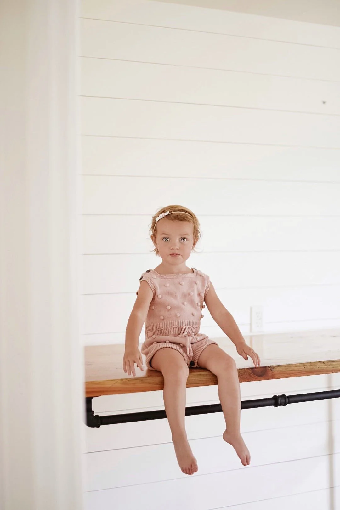 Matilda is precious in our Nora knit romper! !