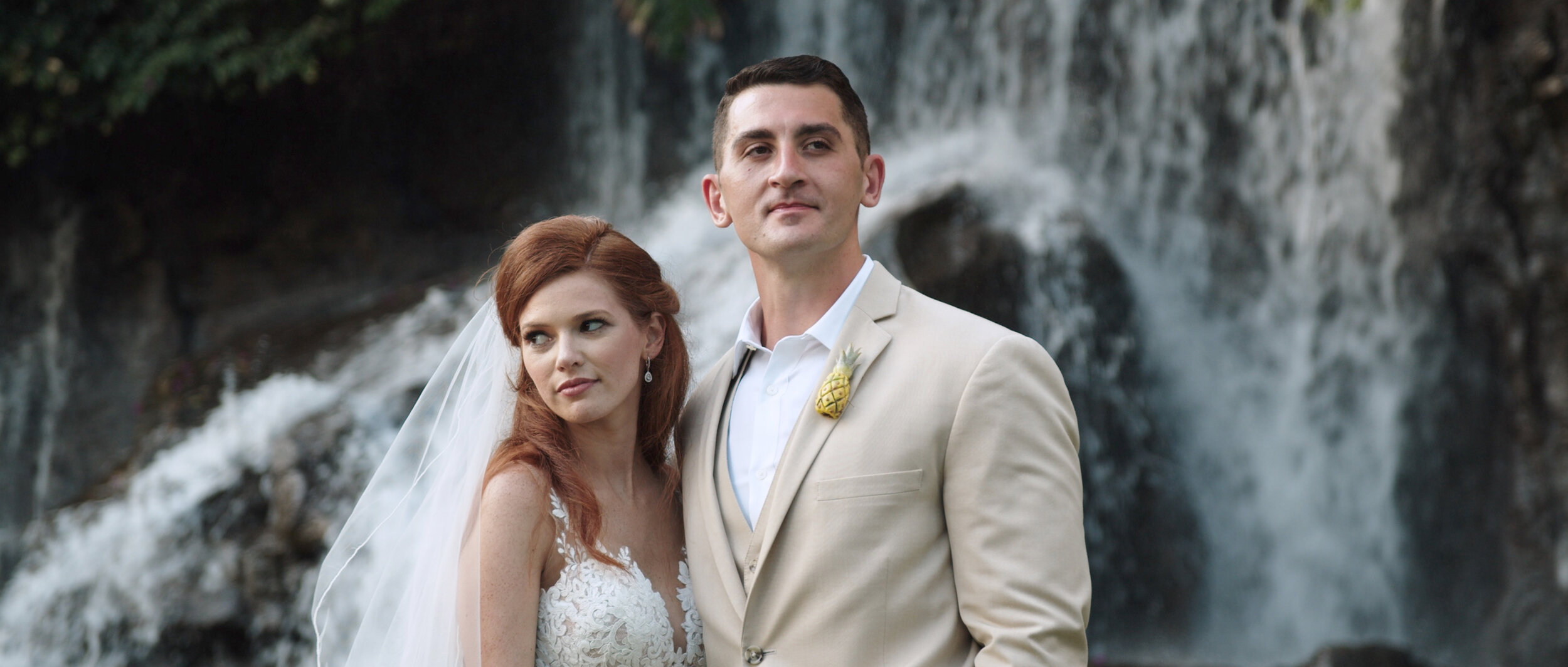 Bride and groom at the Grand Wailea Resort waterfalls