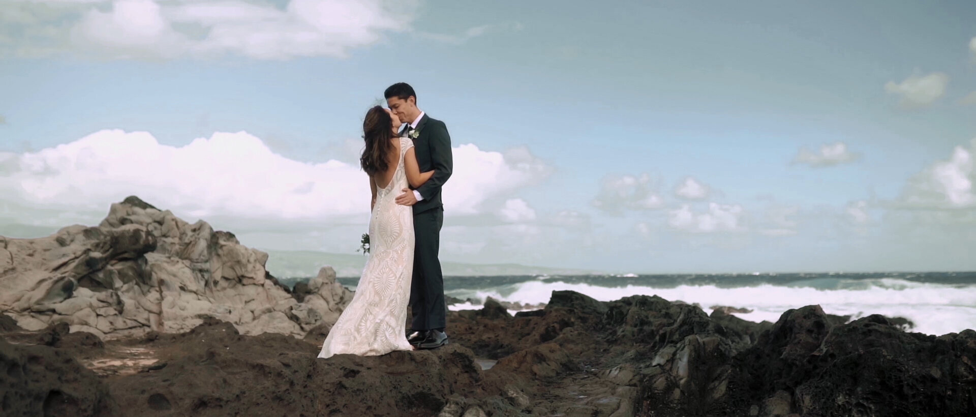 Bride and groom at Ironwoods Beach Cliffs by the ocean