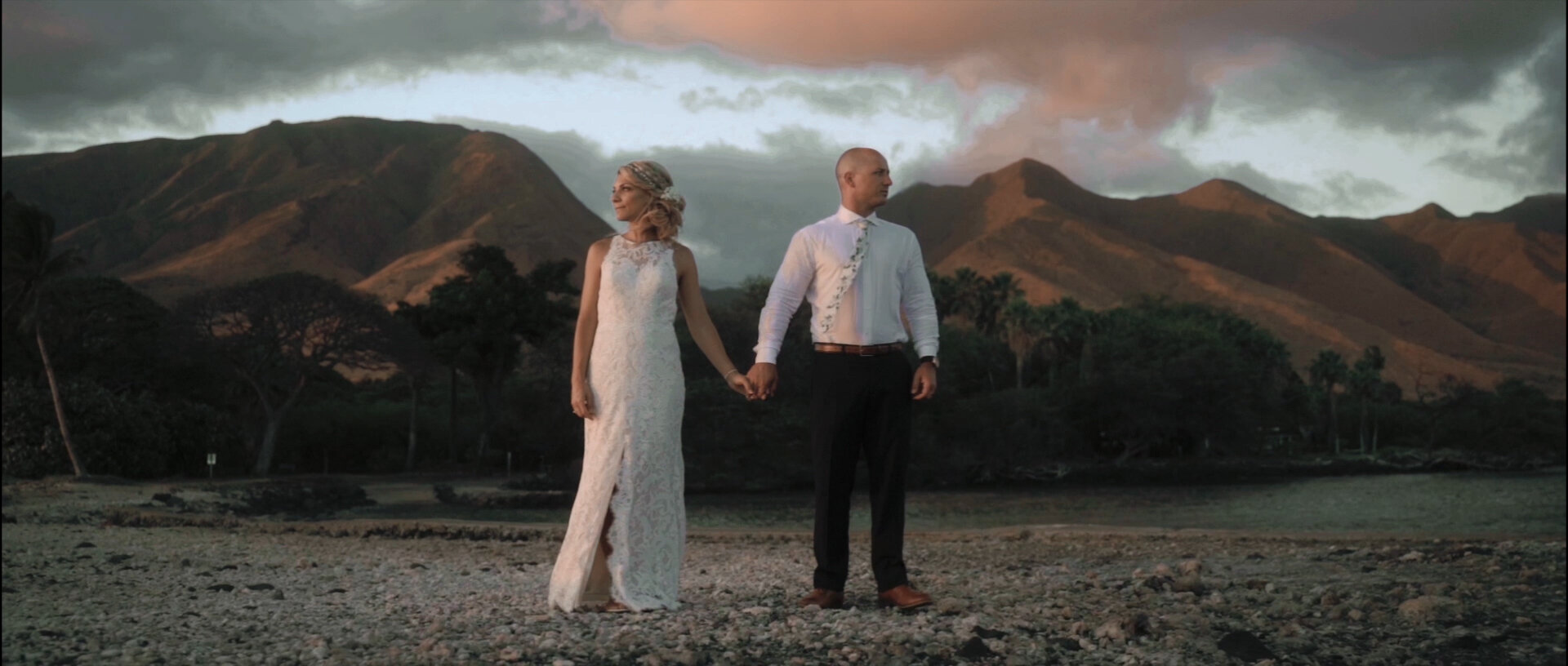 Bride and Groom at the Olowalu Plantation House Pier with mountains backdrop