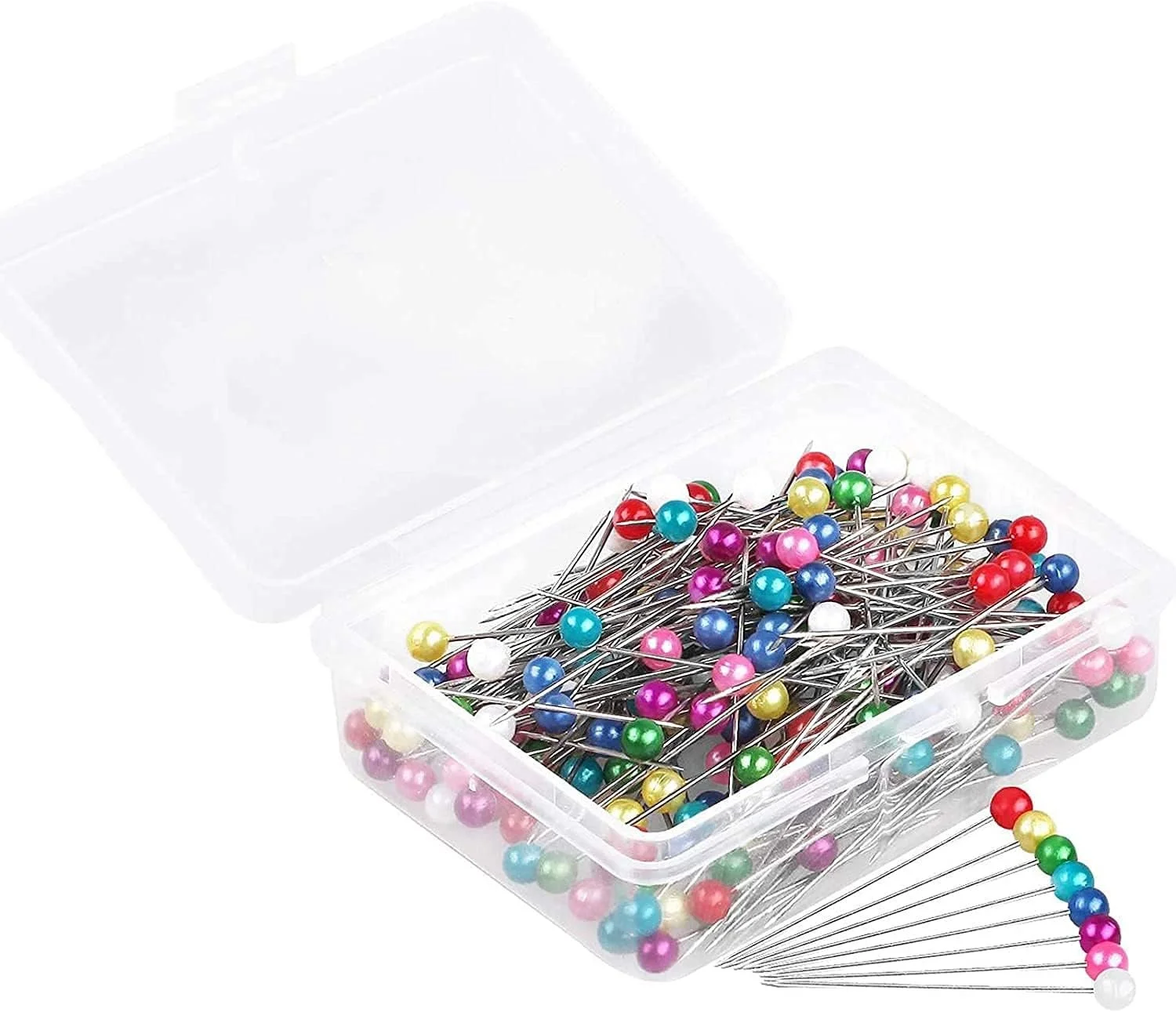 A clear plastic box filled with multicolored sewing pins with round glossy heads. Some pins are outside the box, fanned out for display.