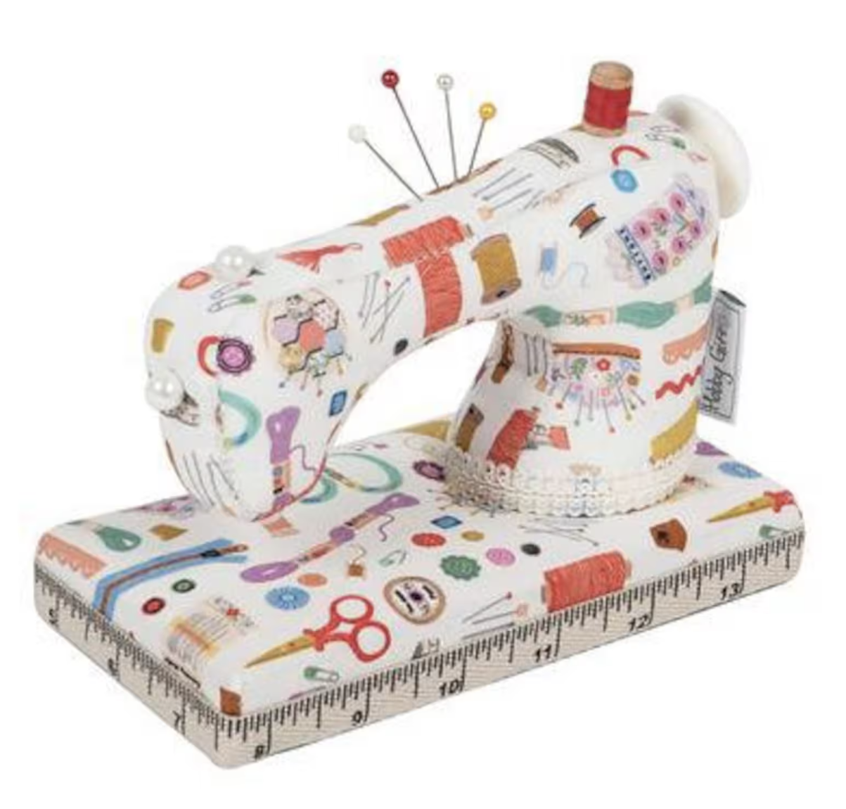 Colorful sewing mannequin shaped like a sewing machine with measuring tape base.
