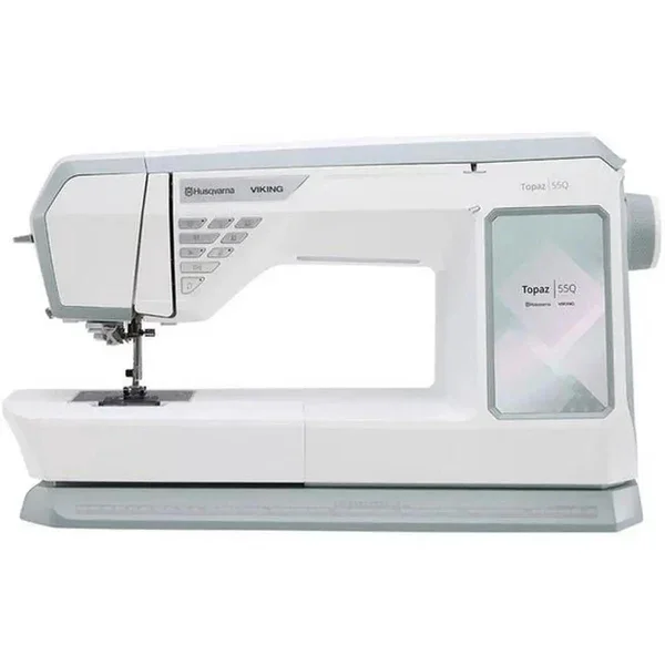 A white industrial sewing machine labeled 'Husqvarna Viking Topaz 55Q' with a digital display and various controls.