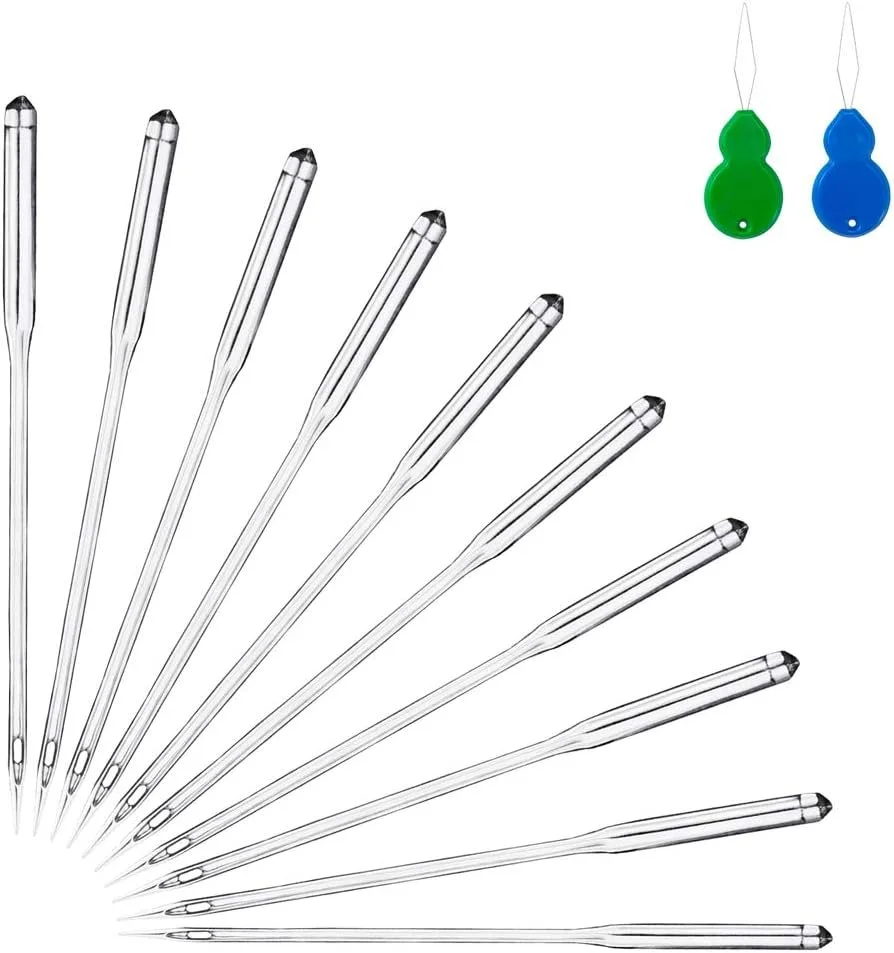 A set of sewing needles arranged in a fan shape with two identical green and blue sewing kits in the background.