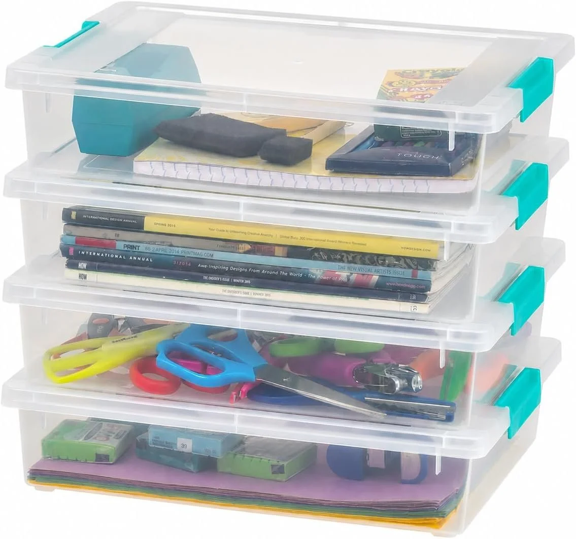 A stack of four transparent plastic storage drawers filled with office supplies and magazines.
