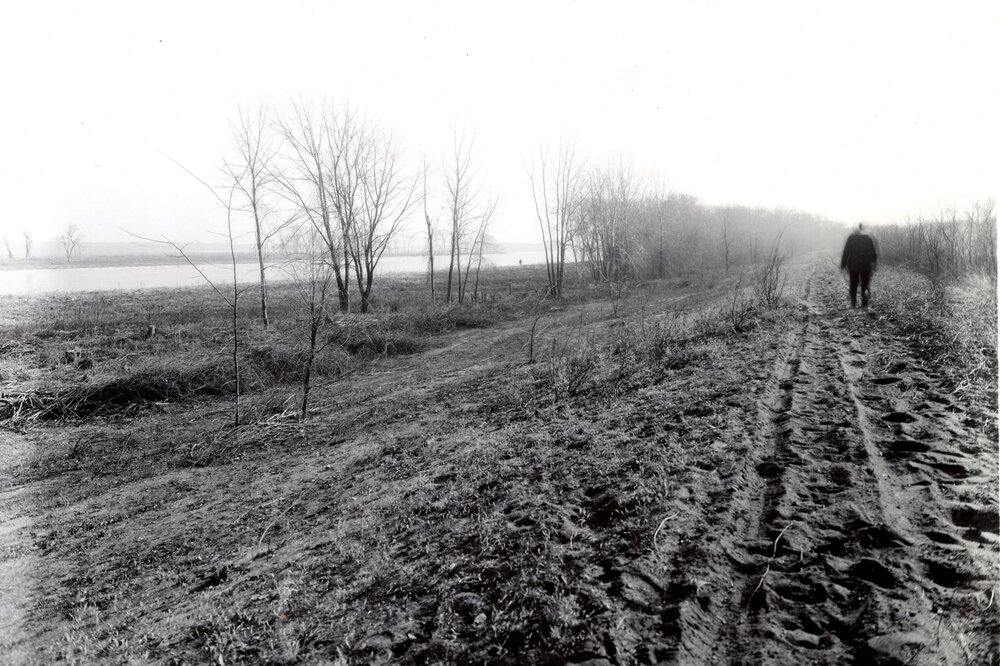 Photo 4-1724 showing a low, sandy levee that separated the northern Port Louisa drainage district from the river.