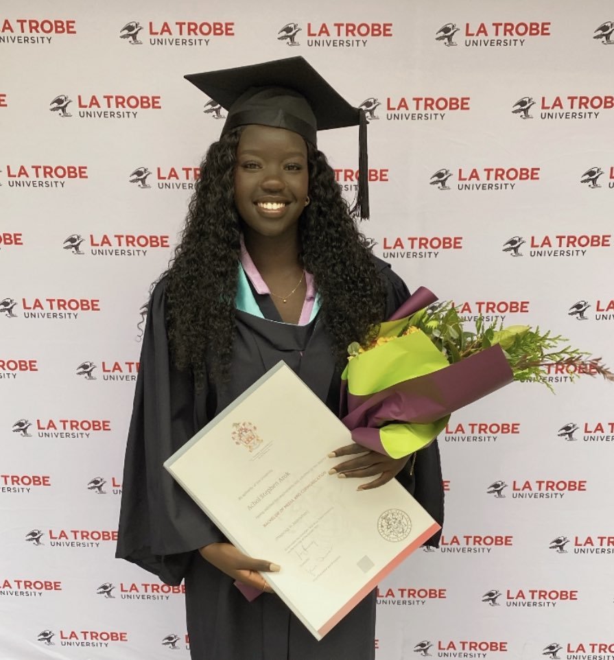  Achol graduating with her Bachelor’s Degree in Media &amp; Communications (Journalism) 