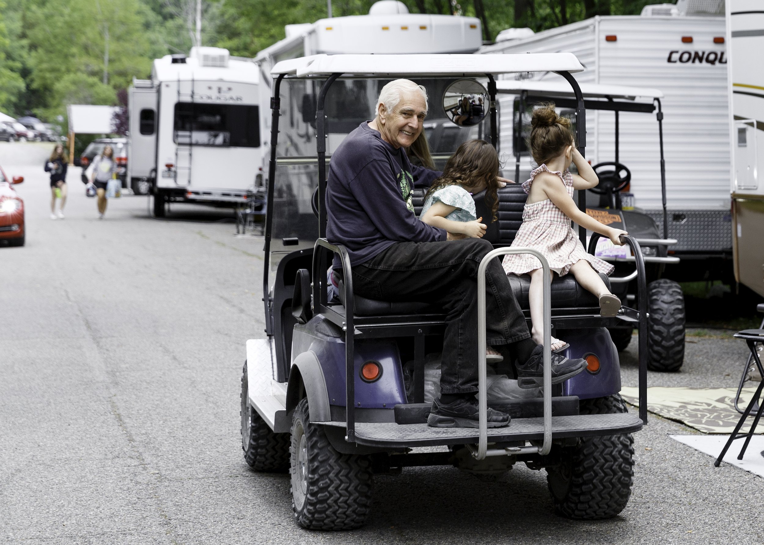 Harry on Golf cart with kids.jpg