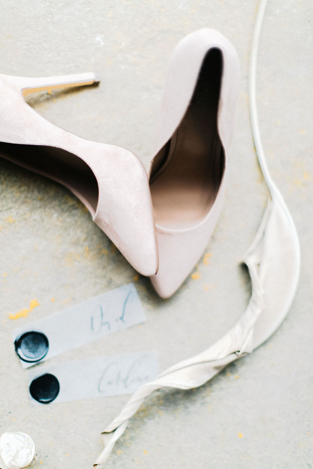 handlettered details next to bride's heels