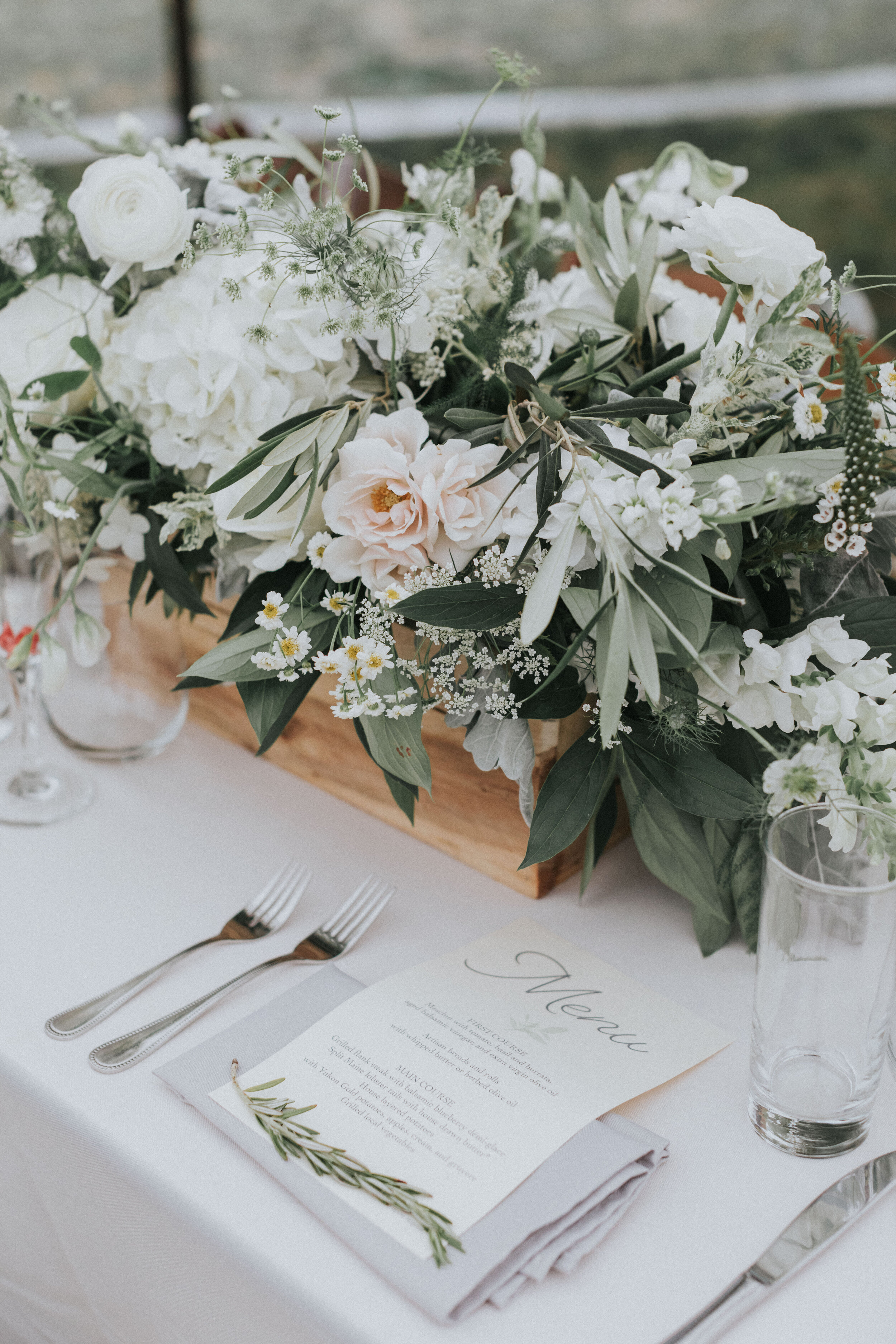 neutral floral arrangement and reception tablescape at Maine wedding